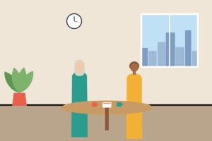 Two colleagues talking over coffee at a small round table