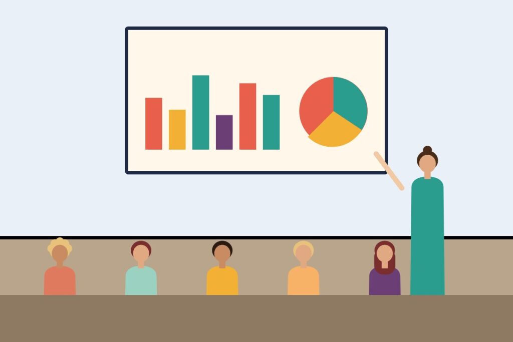 A presenter explaining charts to an attentive audience